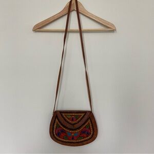 Leather purse with embroidery detail